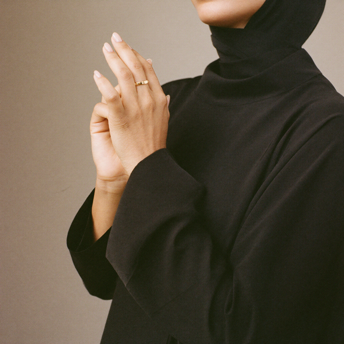 Beauty — modest hands with abaya sleeve