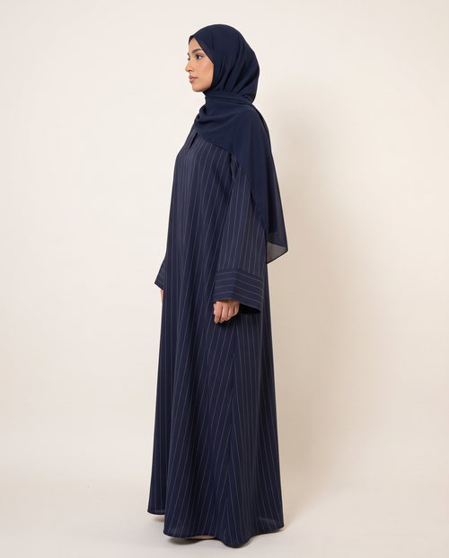 Haya pinstripe abaya in Navy, side view showing the relaxed fit